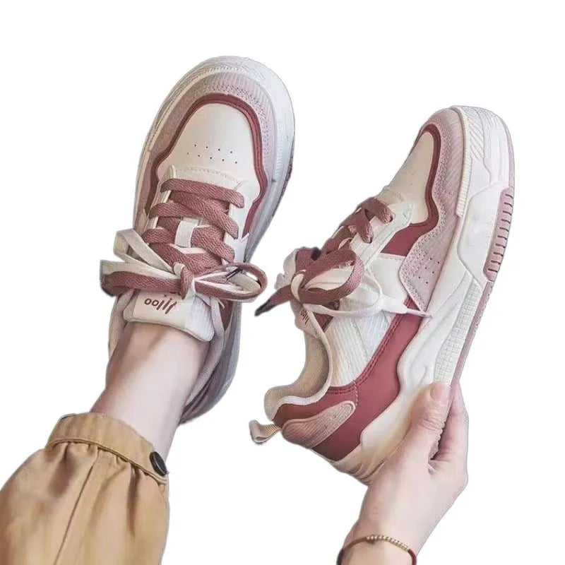 Women's pink and white height increasing rubber sneakers with low-top design