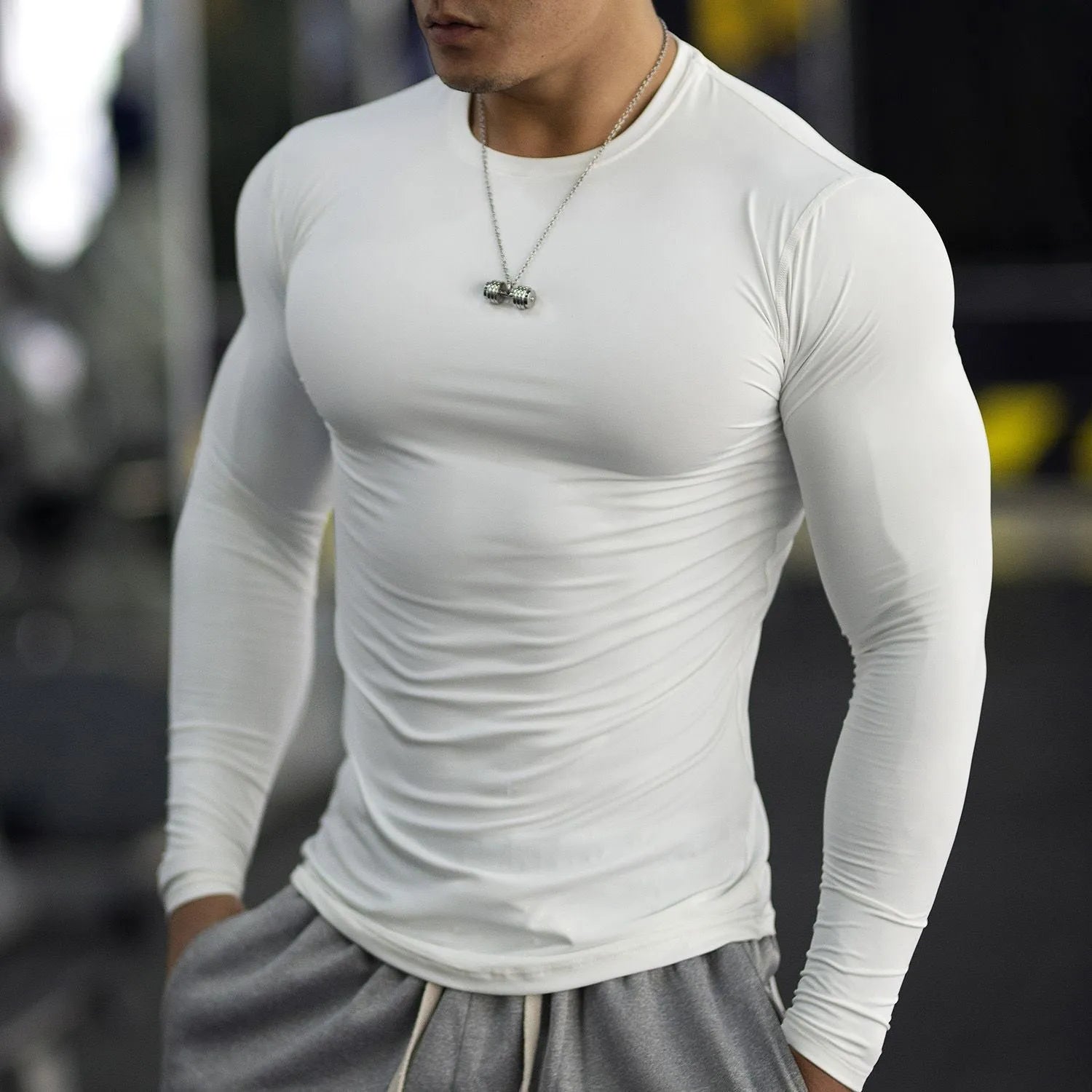 Men's white slim-fit long sleeve fitness top for running and sports activities