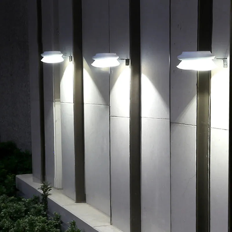 Black and white solar-powered outdoor fence wall lamp with 9 LEDs for garden lighting