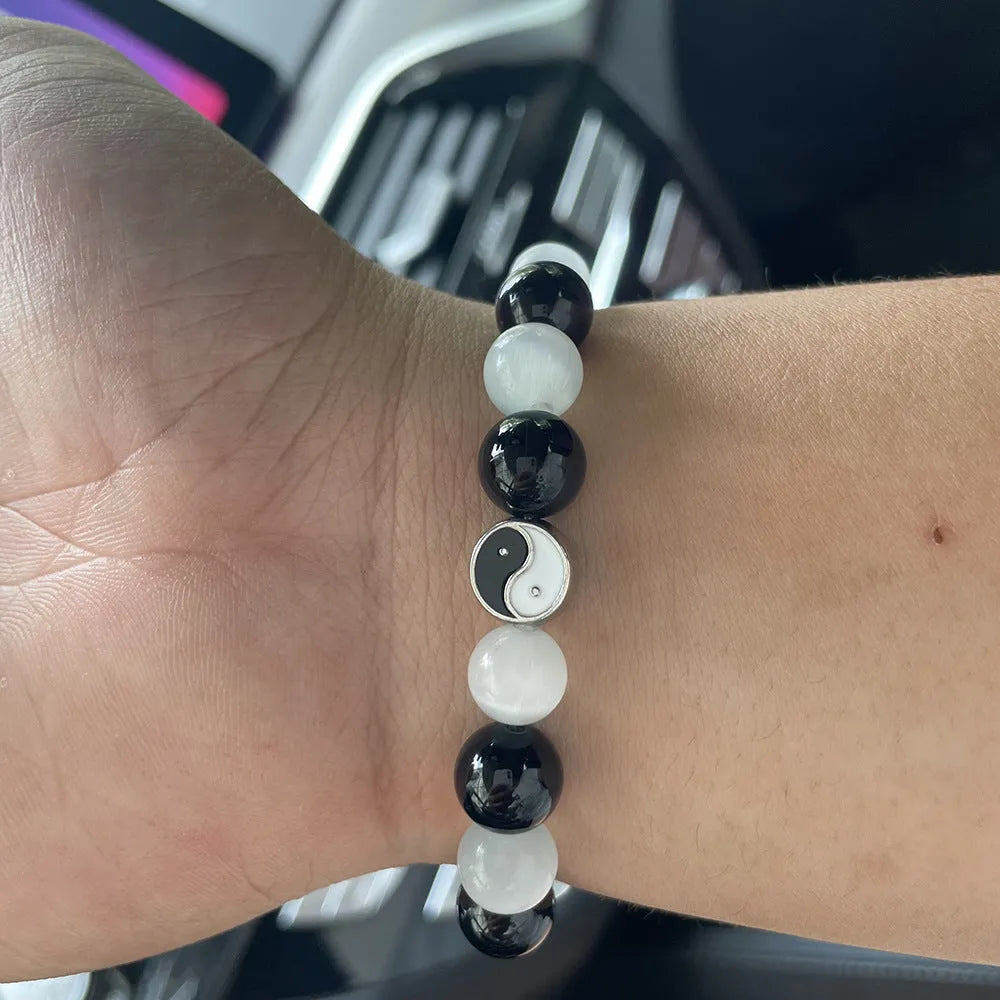 Natural stone Tai Chi bracelet with 10mm polished opal and black agate beads in traditional Chinese beaded design