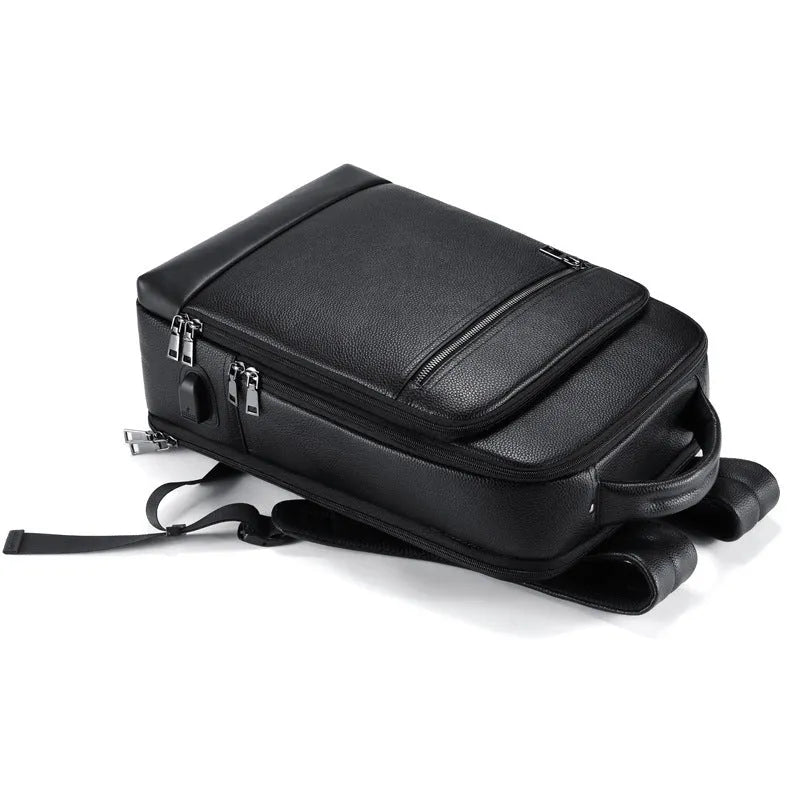 Black genuine leather men's business backpack with curved shoulder straps and visible sewing lines
