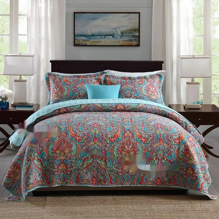 Quilted cotton bed cover set with printed pattern including bedspread and two pillowcases