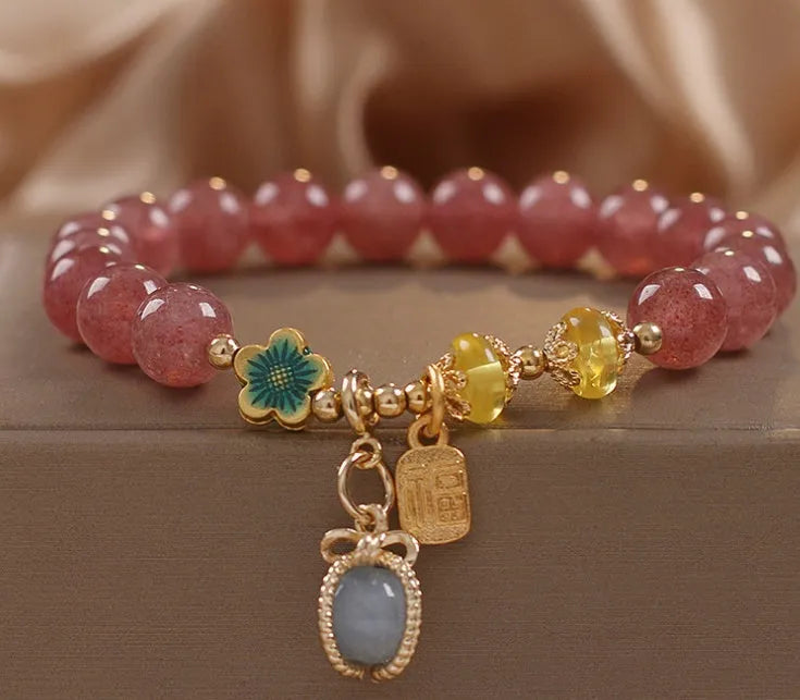 Red women's bracelet with strawberry quartz beads, alloy settings, and sparkling rhinestone details.