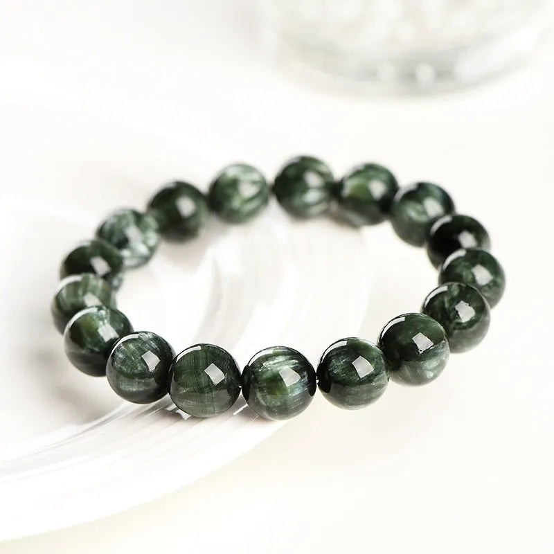 Green dragon crystal bracelet with 8-9mm round beads and ruyi charm on wrist