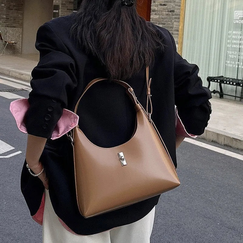 Genuine leather crossbody shoulder bag with sandwich pocket design in dumpling shape