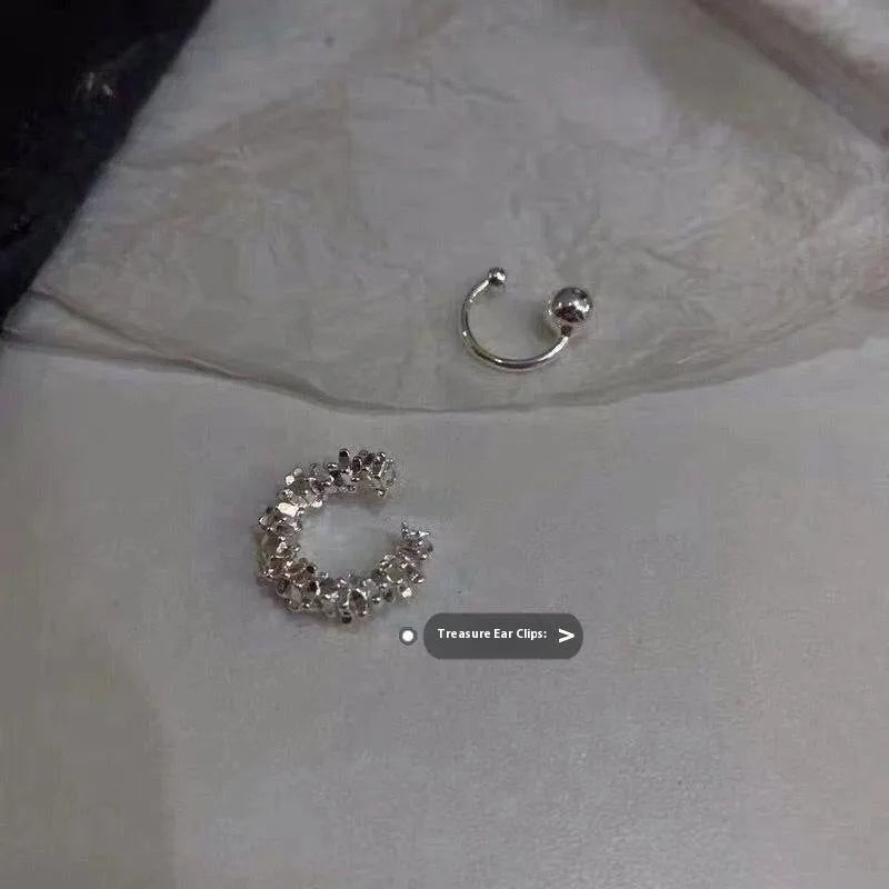 A pair of silver-toned geometric clip-on earrings with an irregular frosty finish and double drop design.