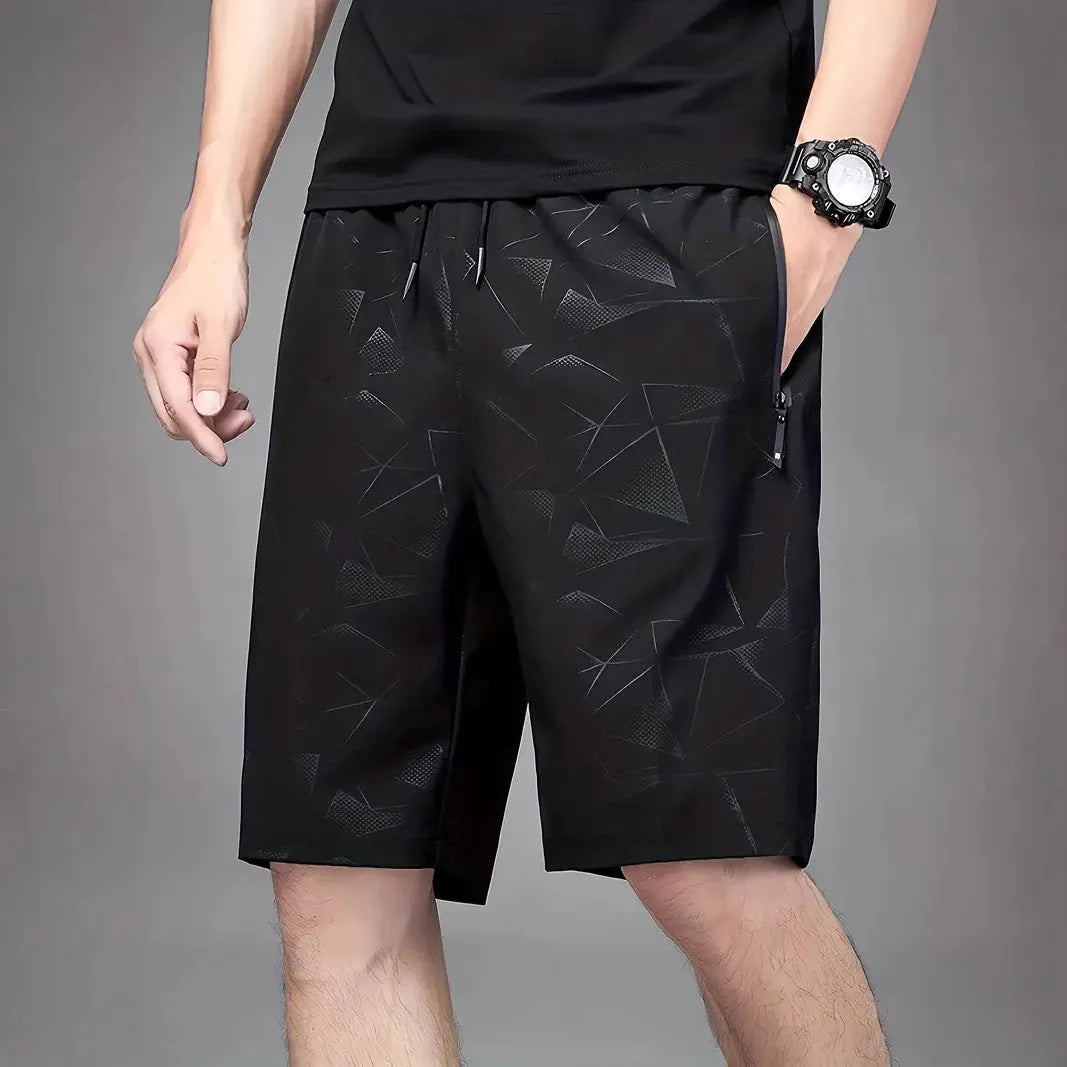 Men's loose-fitting polyester sports shorts in three colour options with printed design