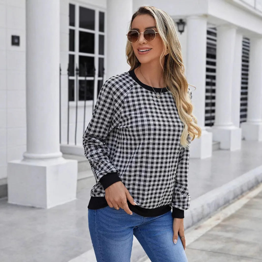 Black long sleeve polyester sweater with striped plaid print pattern