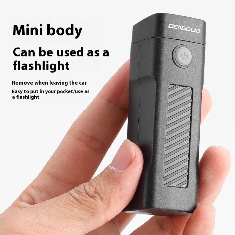 Black USB rechargeable bicycle headlight with LED and quick-release strap mount on handlebars.