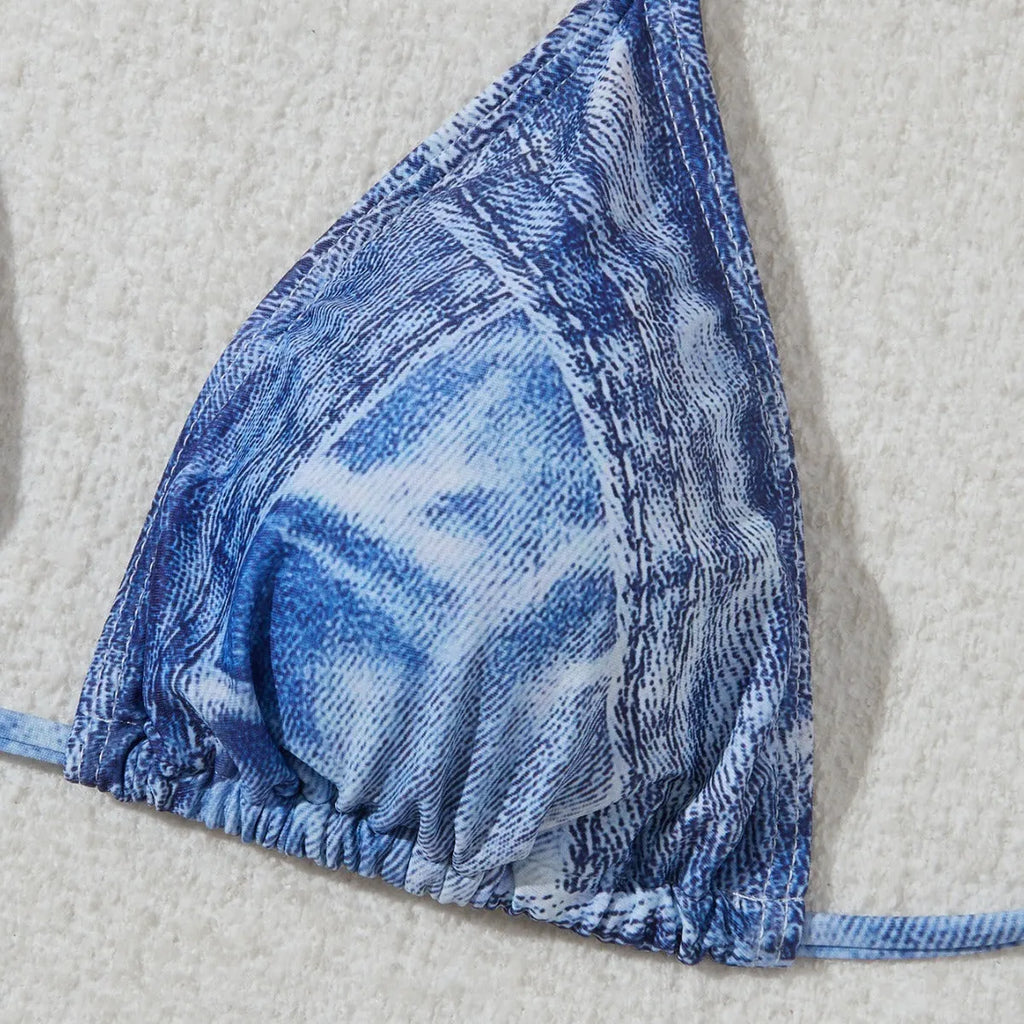 Denim blue women's bikini set with printed design and strap detail, sizes S to XL.