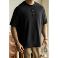 Casual loose-fitting pullover top with raglan sleeves in a terry texture fabric.