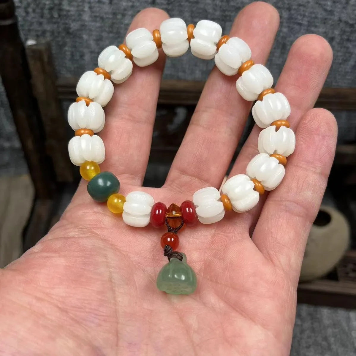 Carved bodhi root pumpkin lotus bracelet with white jade beads and mixed sizing