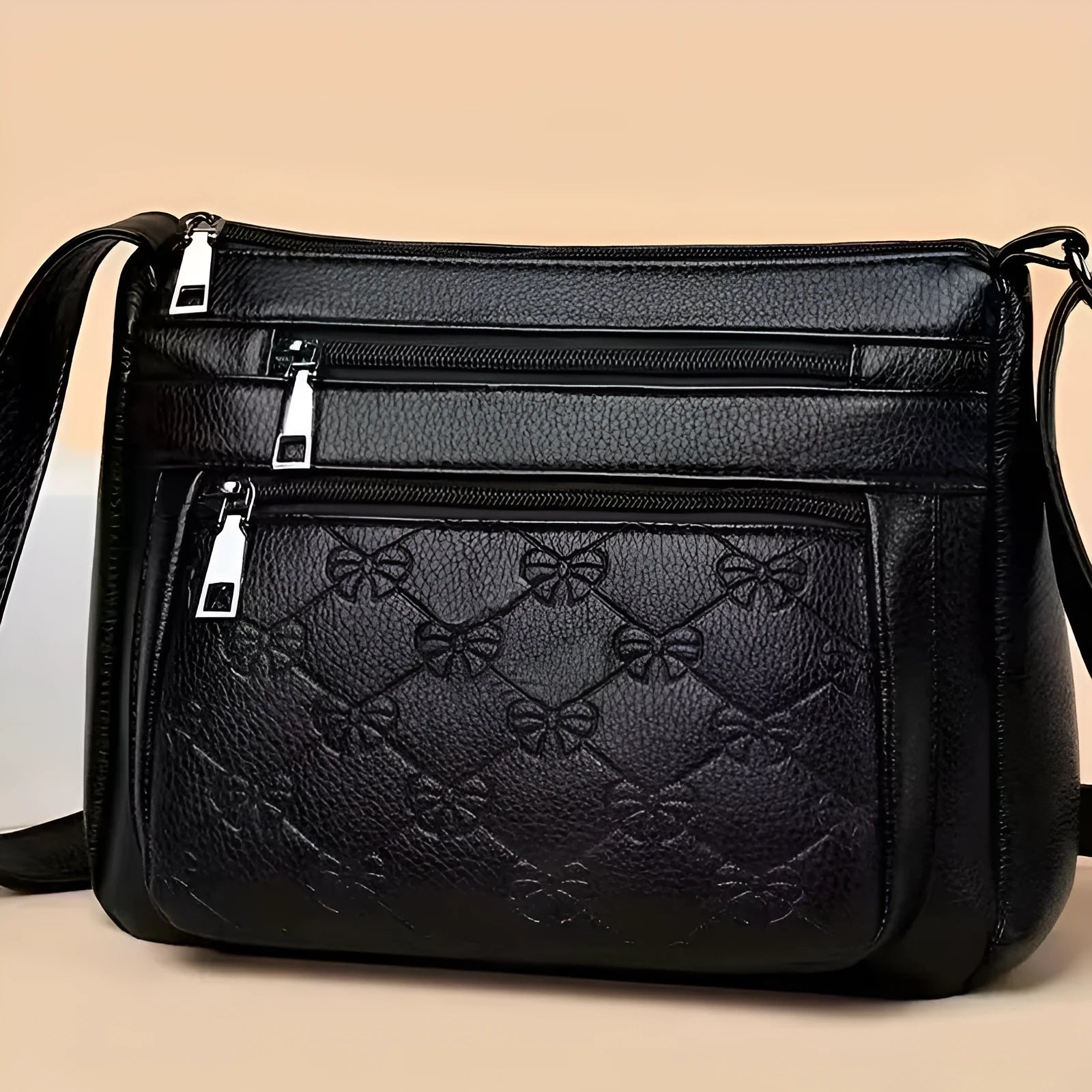 Butterfly black PU leather crossbody messenger bag showing embossed texture and sewing thread details
