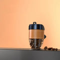 Cup-shaped car air freshener with coffee beans fragrance in plastic housing