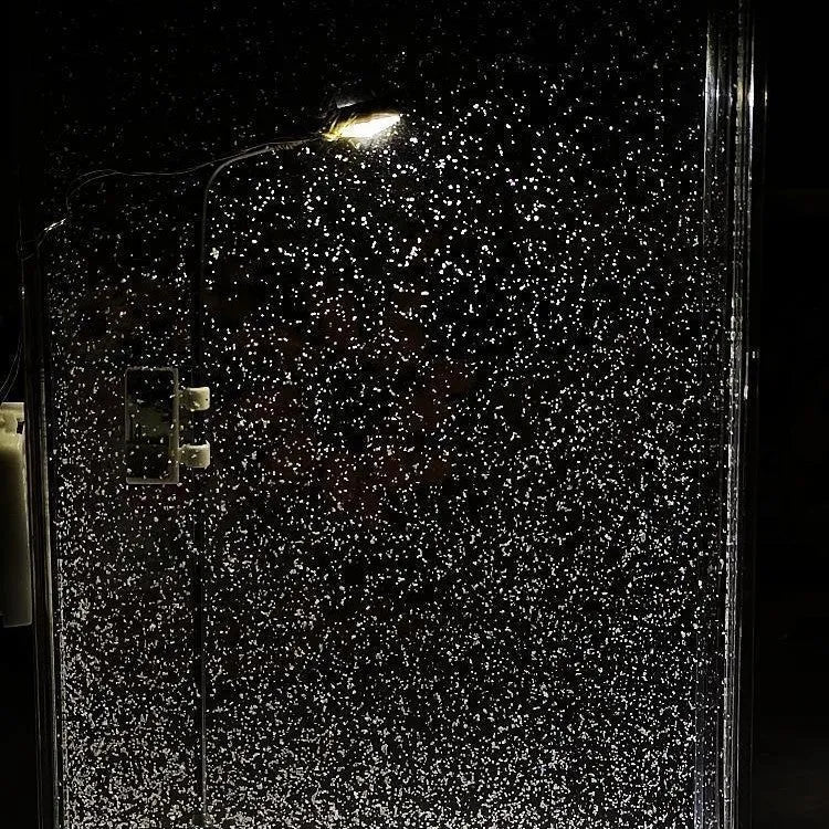 DIY snowy night light kit showing miniature street light and landscape with warm LED glow