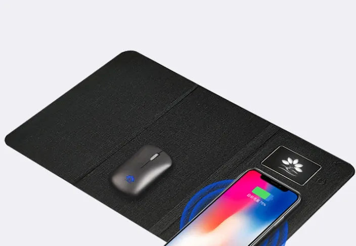 Folding wireless charging mouse pad set with luminous surface and compact Bluetooth mouse on a desk