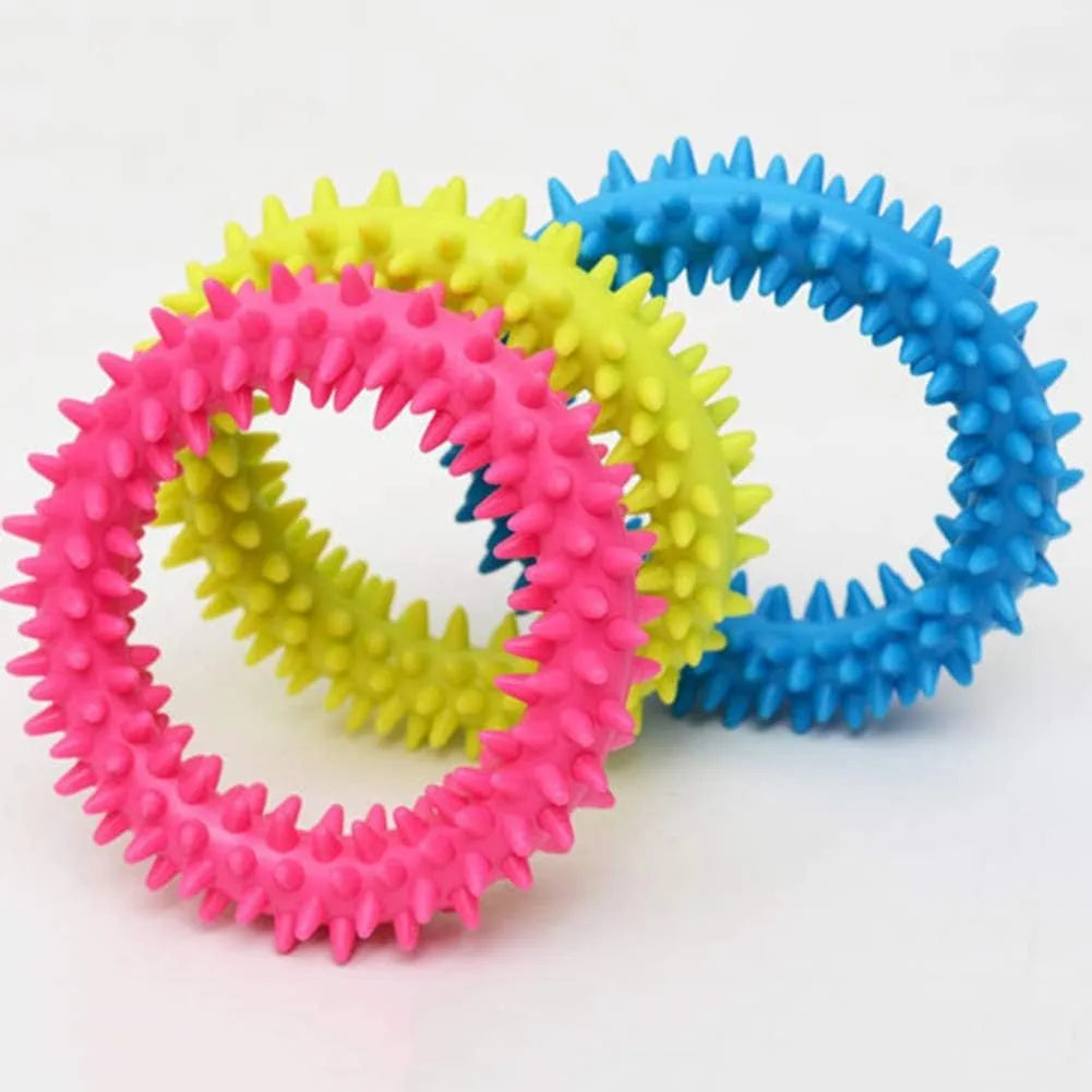 Blue TPR spiky circle ring dog chew toy for dental cleaning on a white background.