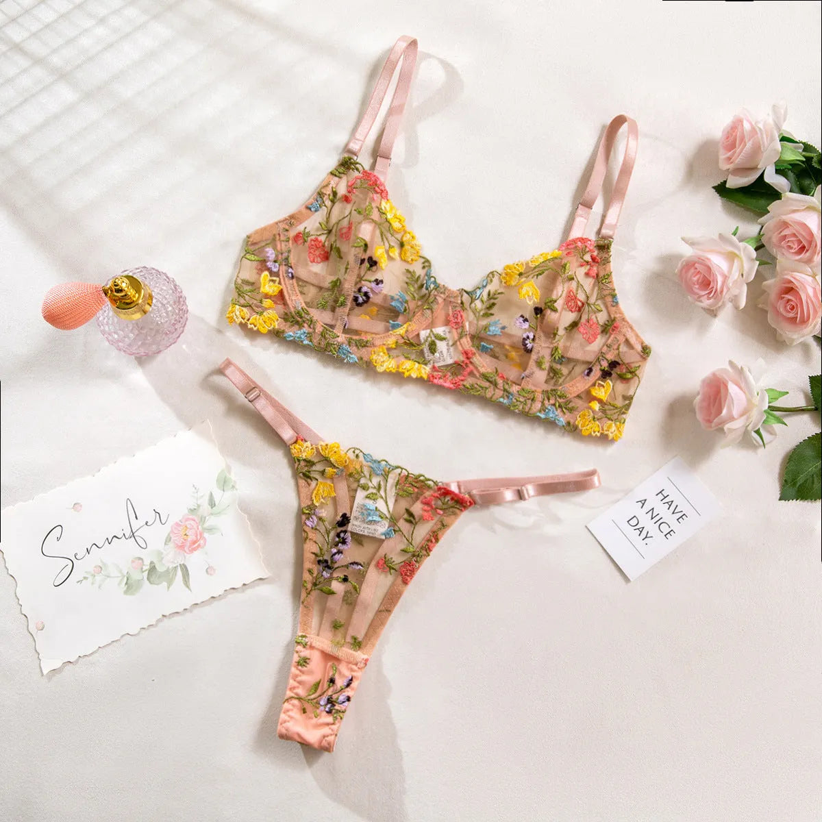 Women's floral bikini-style underwear set in skin tone, purple, black, yellow, or pink colours