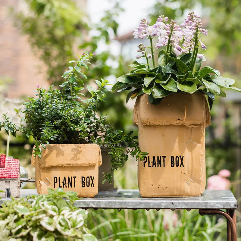 Nordic-style cement brown paper box flowerpot for indoor planting on a floor.