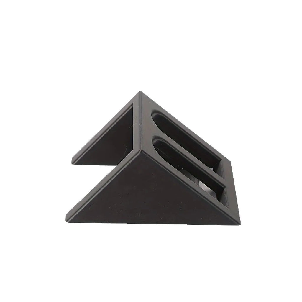 Black plastic pistol display stand for handguns and replicas on a flat surface.
