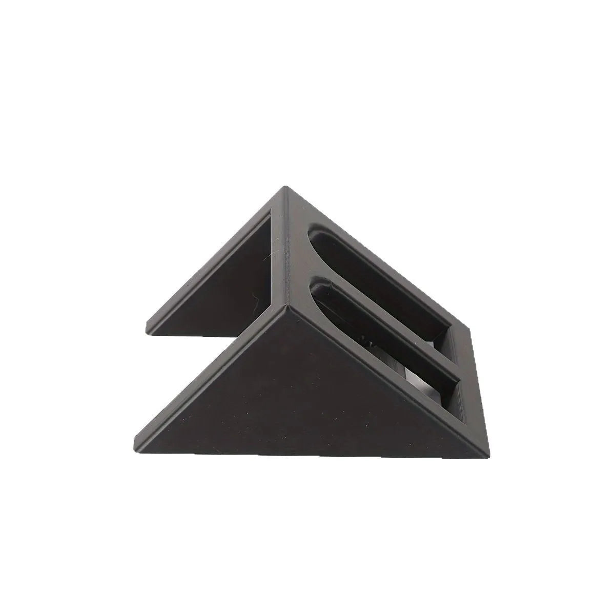 Black plastic pistol display stand for handguns and replicas on a flat surface.
