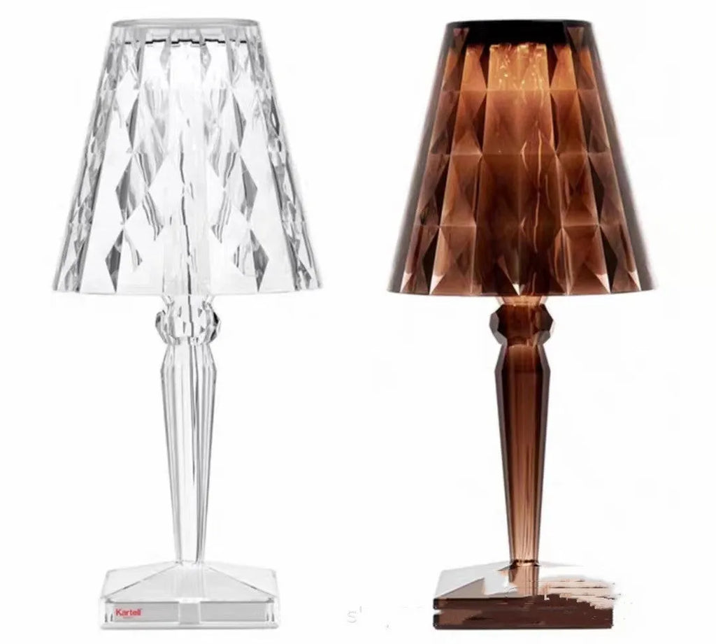 Rose gold portable touch projection night light on a surface showing its acrylic construction and compact size