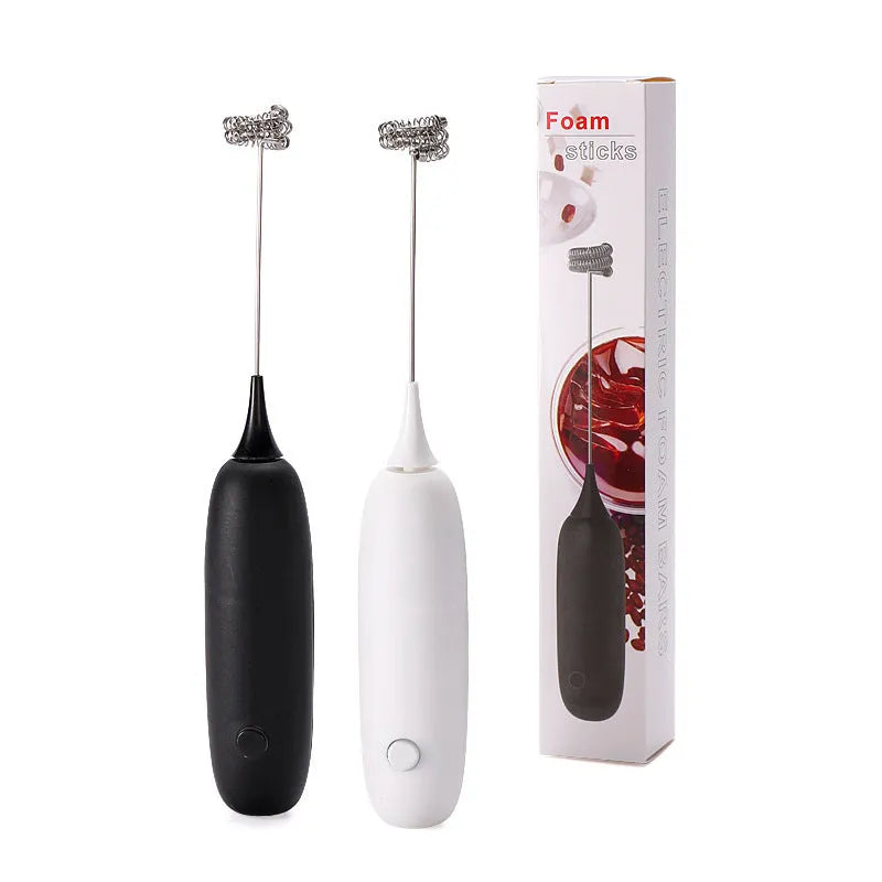 Hand-held electric milk frother blender in black or white colour for coffee preparation