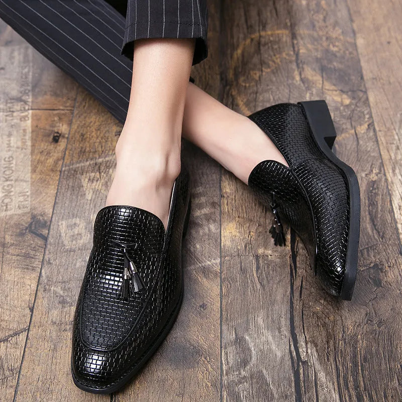 Men's black pointed toe slip-on business shoes with tassel detail on artificial PU upper