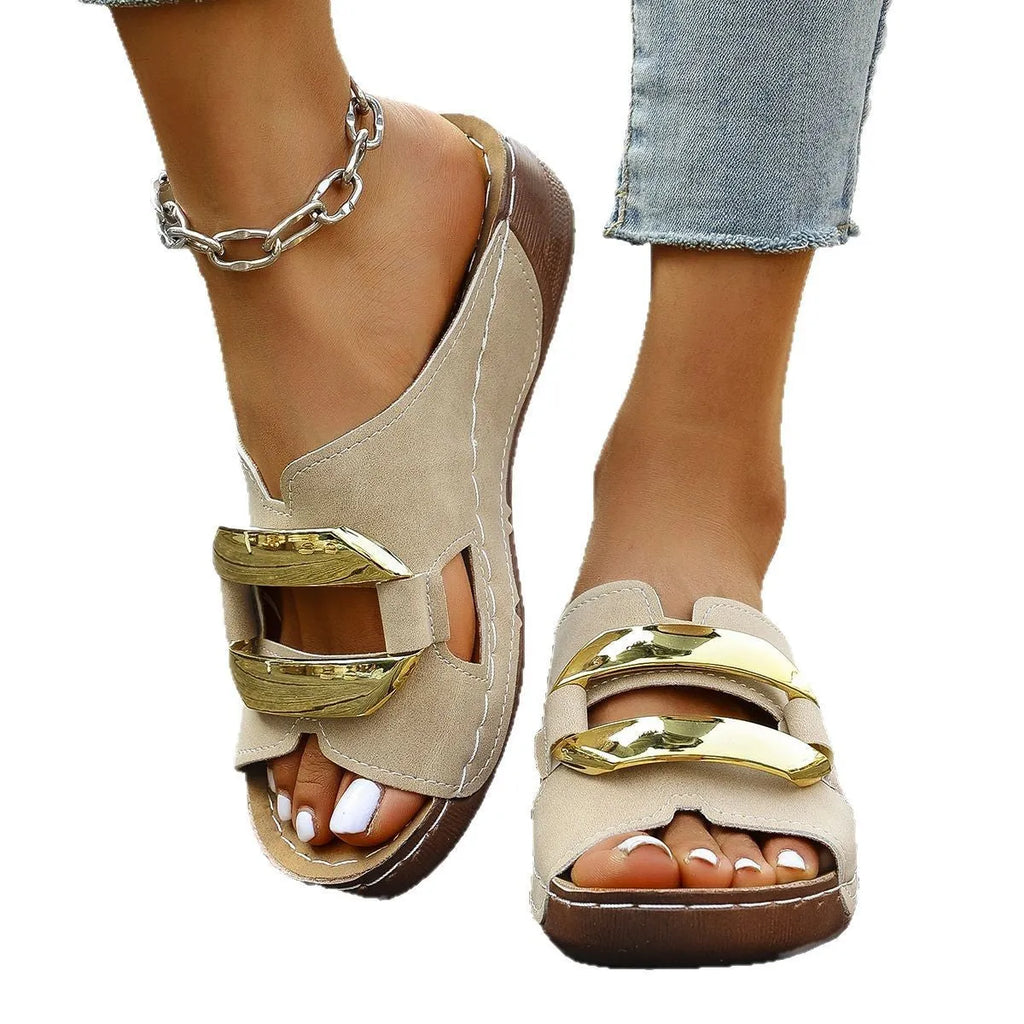 Men's white Roman-style platform sandals with a flat rubber sole and decorative metal details on the strap.