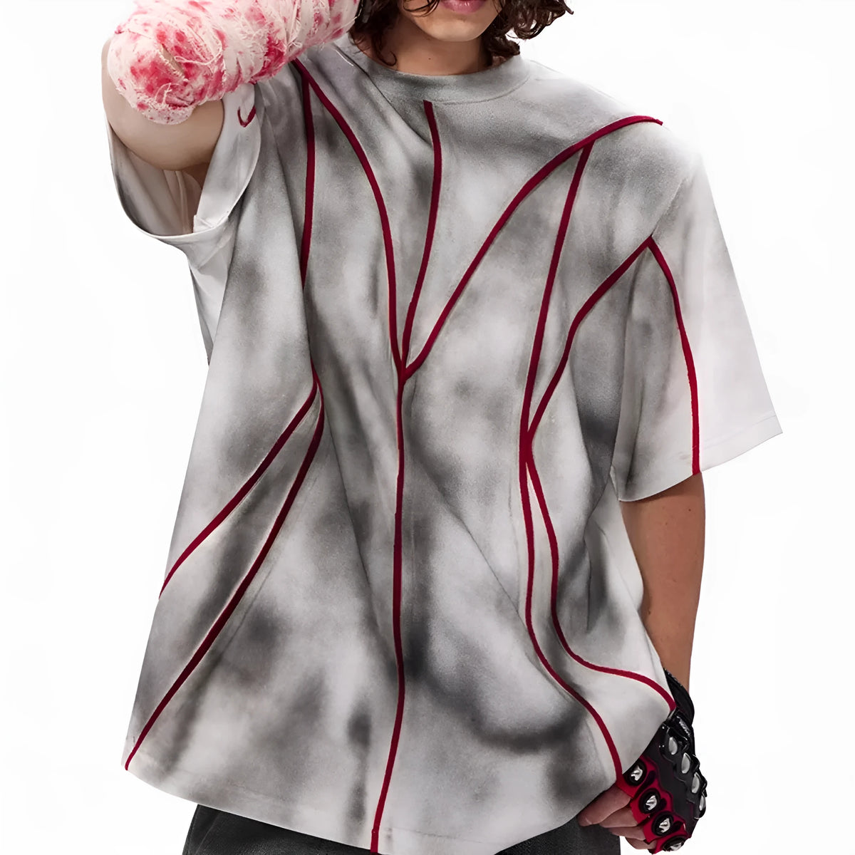 Women's short sleeve t-shirt with padded shoulders and textured line patchwork detail on a round neck.