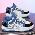 Men's black chunky sneakers with a cartoon totem pattern on the synthetic leather upper.