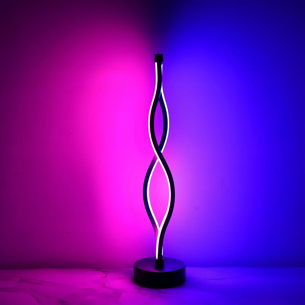 Black aluminum desk lamp with a touch dimming base on a wooden desktop.