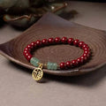 Women's wave-shaped cinnabar and copper bracelet in national style design