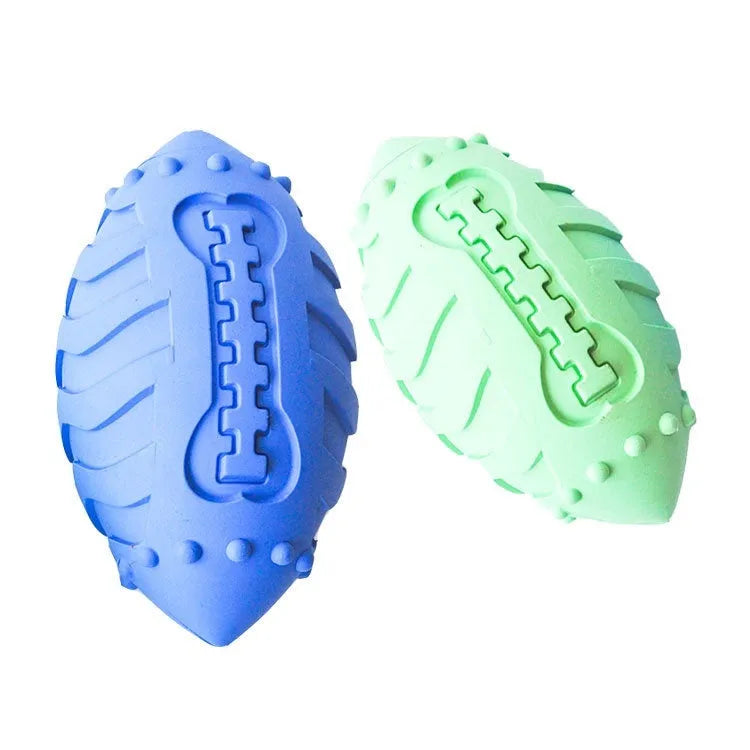 Light green rubber rugby ball dog chew toy with textured surface for teeth cleaning