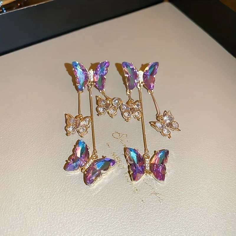 Silver needle crystal flowers butterfly tassel earrings in blue purple colour on alloy backing