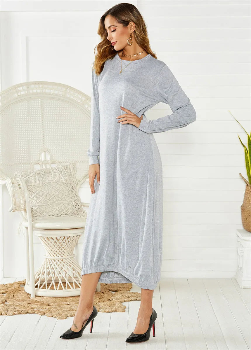 Black lace-up crew neck long lantern dress on a hanger, showing loose fit and lace detail.