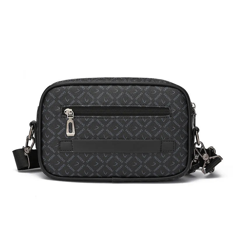 Men's black geometric pattern messenger bag showing shoulder strap and handheld carrying options