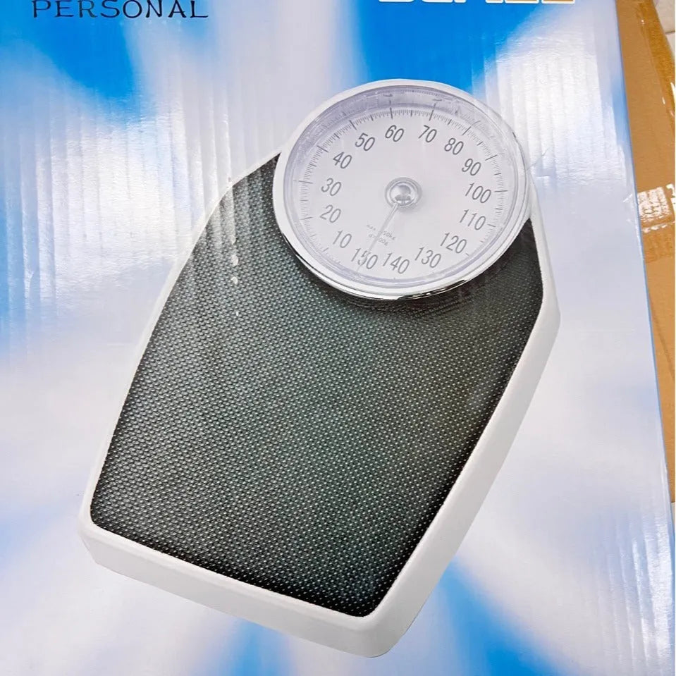 Black mechanical bathroom scale with large analogue dial on a 47x35cm platform.