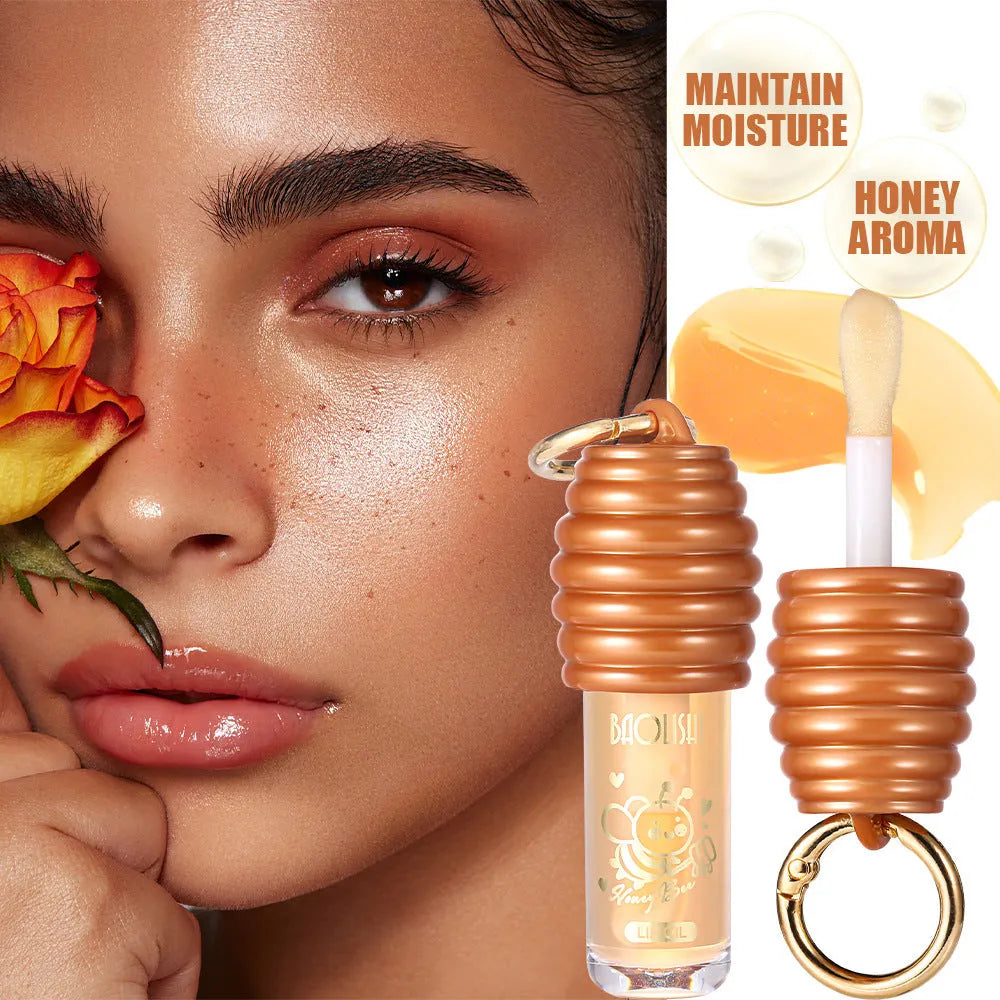 Honey-coloured lip gloss with keychain attachment for portable carrying on bags