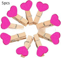 Set of five handmade solid wood heart-shaped clips in various colours