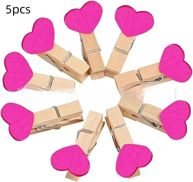 Set of five handmade solid wood heart-shaped clips in various colours