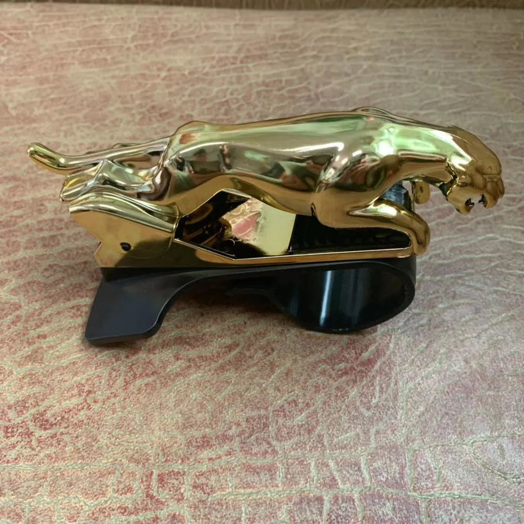 A black rotatable car mobile phone holder made of ABS plastic, mounted on a dashboard.