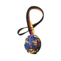 Floating water bite-resistant pet training ball in camouflage and yellow colours showing three size options