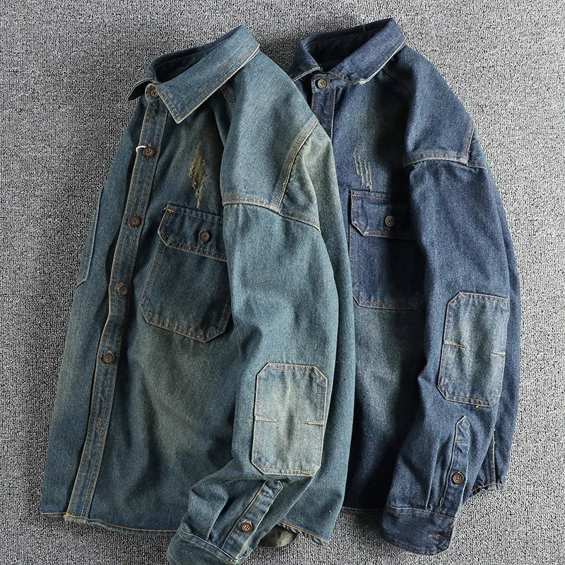 Men's light blue vintage wash denim shirt with loose fit and long sleeves on hanger