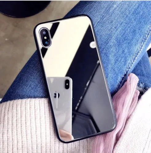 Black iPhone case with a reflective mirror surface on the back, compatible with iPhone X and iPhone 7/8 Plus models.