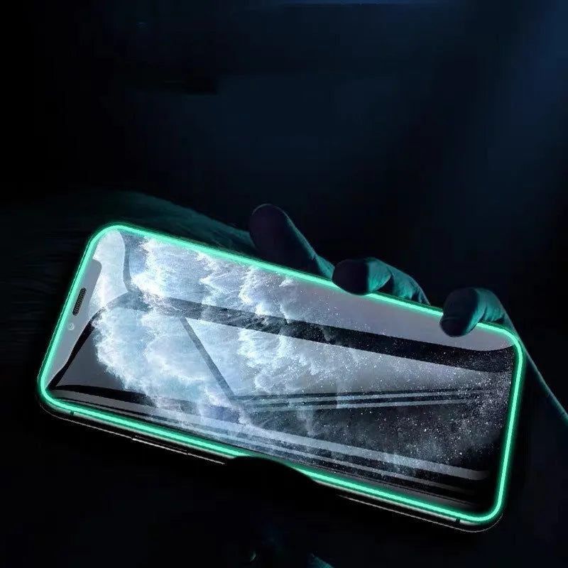 Luminous full cover tempered glass screen protector for iPhone glowing in the dark.