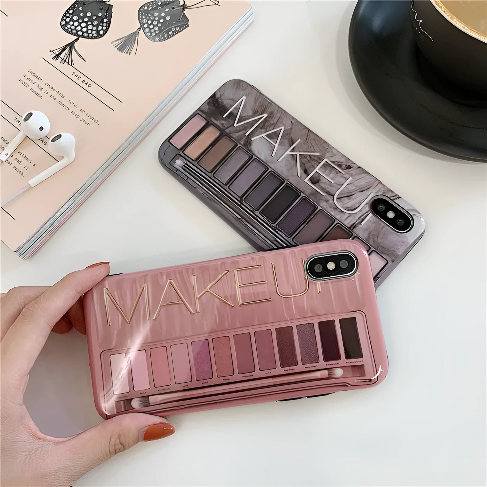 A flesh-coloured silicone case next to a grey one for various iPhone models.