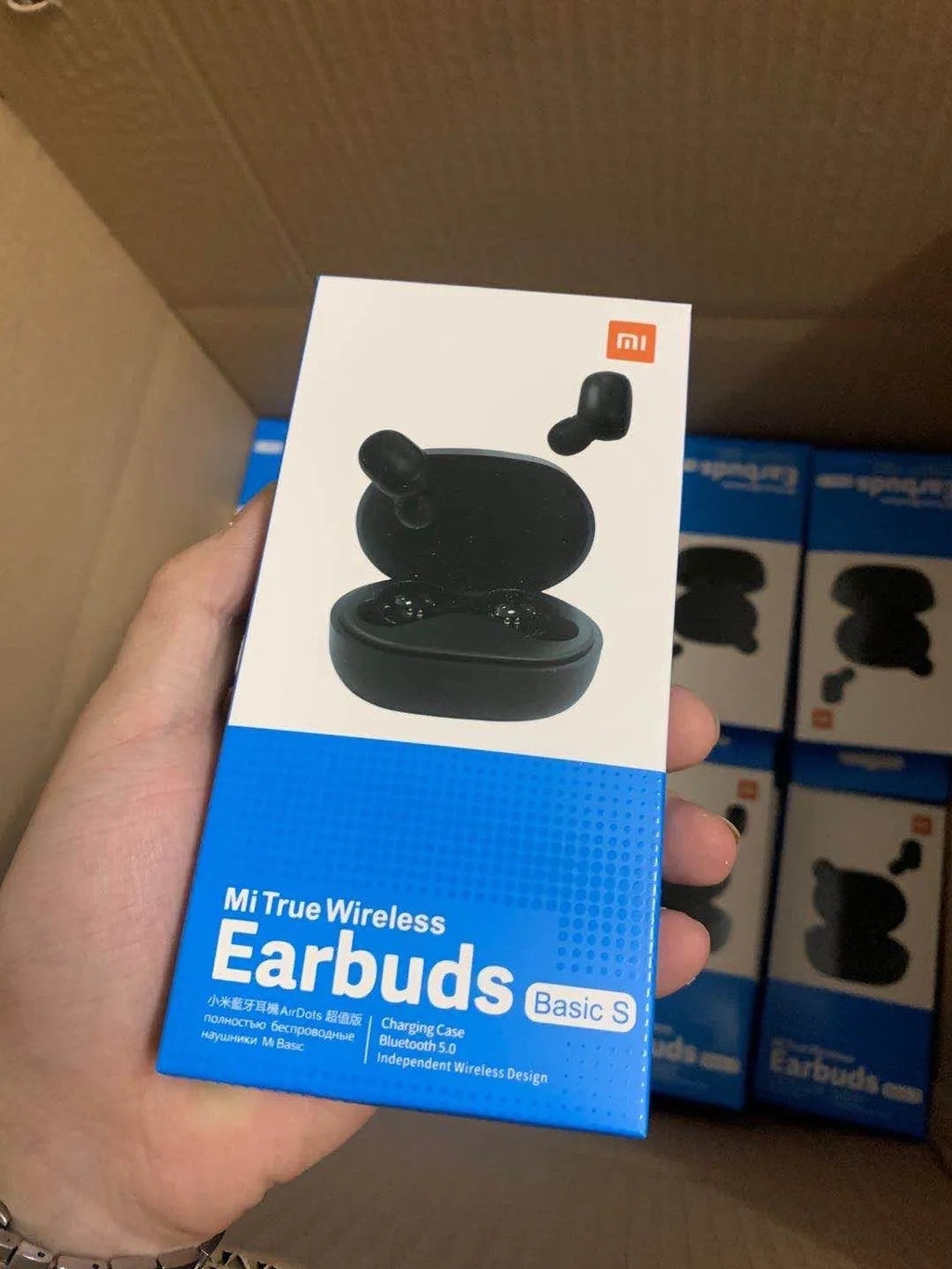 Black Redmi AirDots 2 True Wireless earbuds and charging case on a white background.