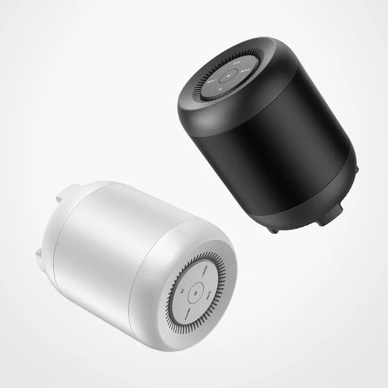 Black and white Bluetooth speaker with AI voice control features and circular plastic housing