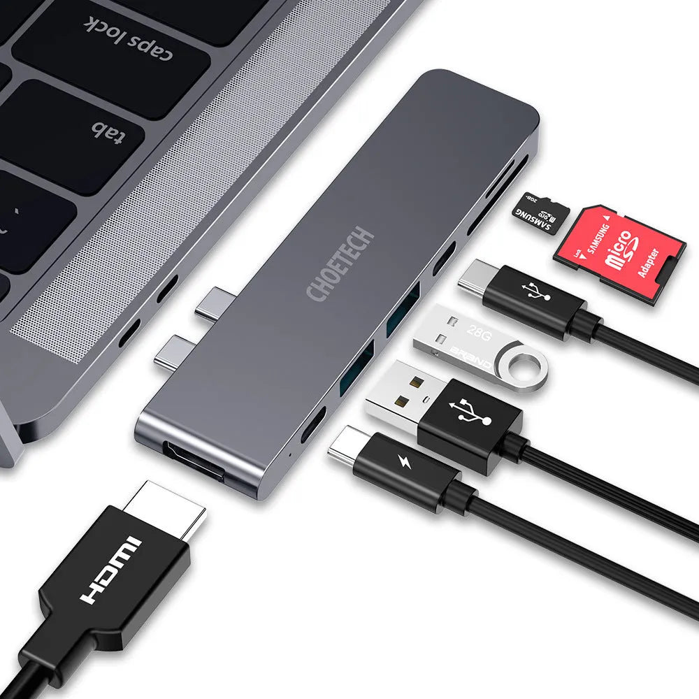 USB Type C adapter hub with multiple ports including Thunderbolt 3, HDMI, SD card slot, and USB 3.0